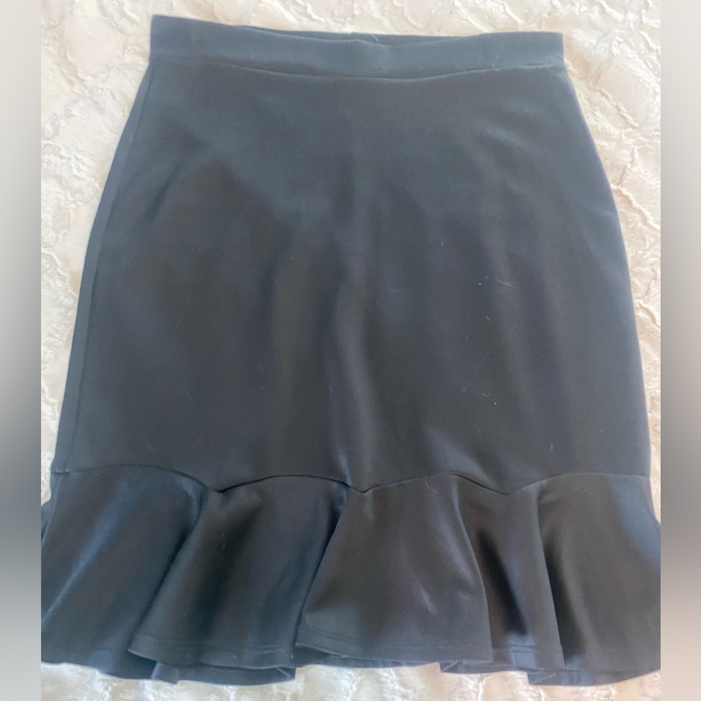 Black pencil skirt with flared end. One fashion size x-large